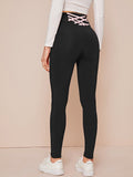 Leggings a croce con fasce in vita