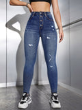 Jeans skinny strappati vita alta con bottone