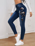 Jeans skinny con ricamo floreale