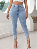 Jeans skinny con strappati con strass orlo con frange