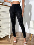 Leggings con strass contrasto con cuciture a contrasto